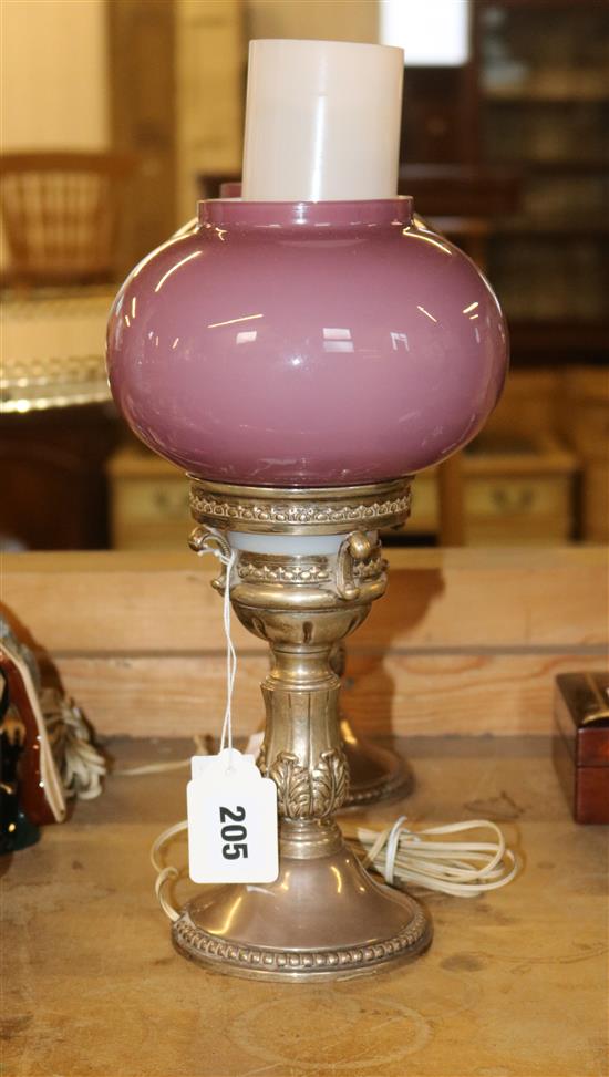 Pair of Spanish white metal table lamps, with clear glass chimneys and pink opaque glass bulbous shades